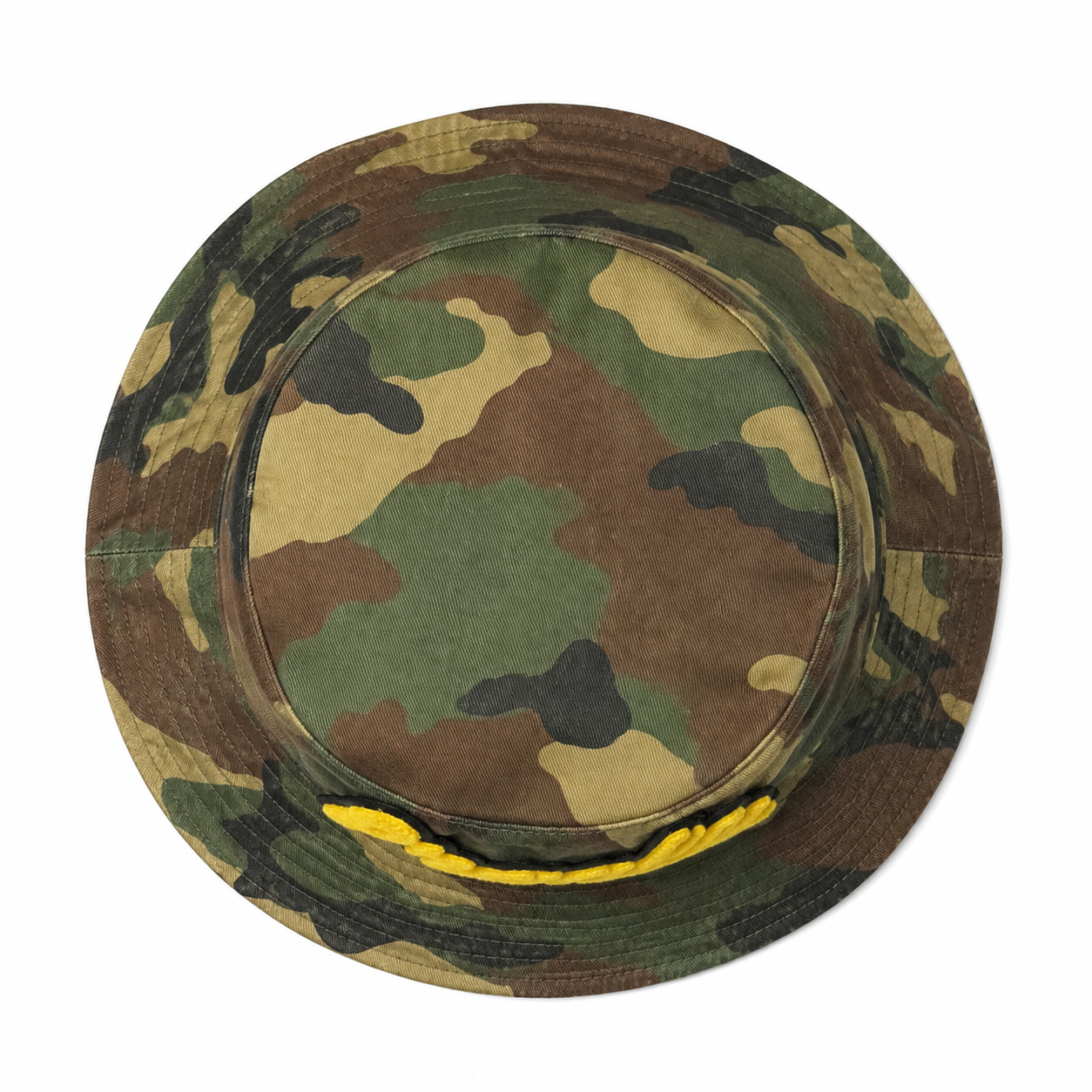 Top view of a custom vintage camouflage bucket hat with washed cotton fabric and chenille logo detail.