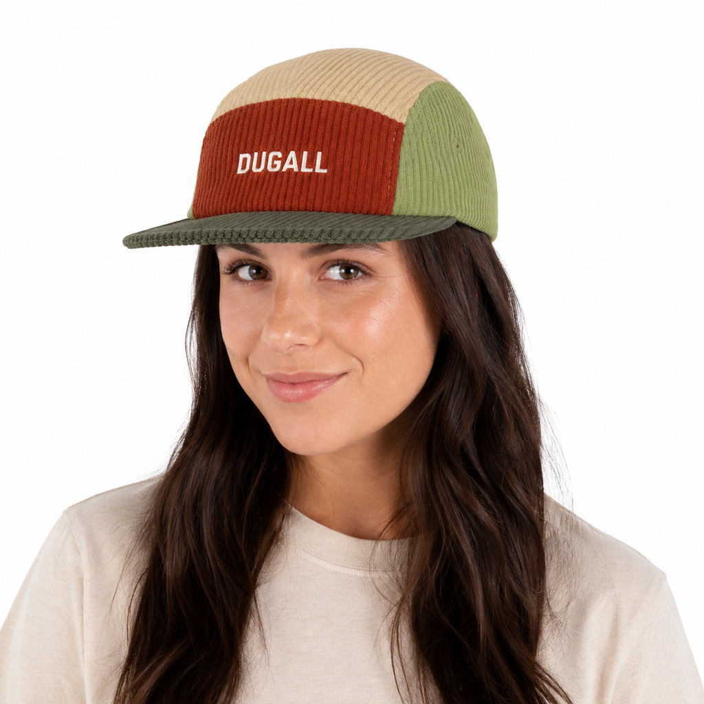 Female model wearing a custom color block corduroy 5 panel cap with embroidered logo