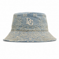 Front view of a custom high quality bucket hat made from washed cotton with 3D embroidery logo and decorative embroidered pattern.