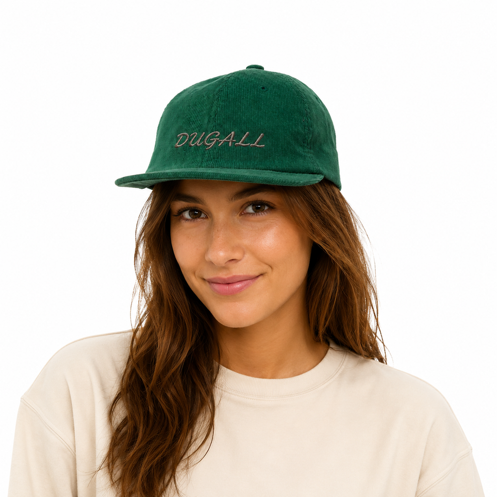 Female model wearing a green custom corduroy baseball cap with embroidered logo in a casual fashion look.