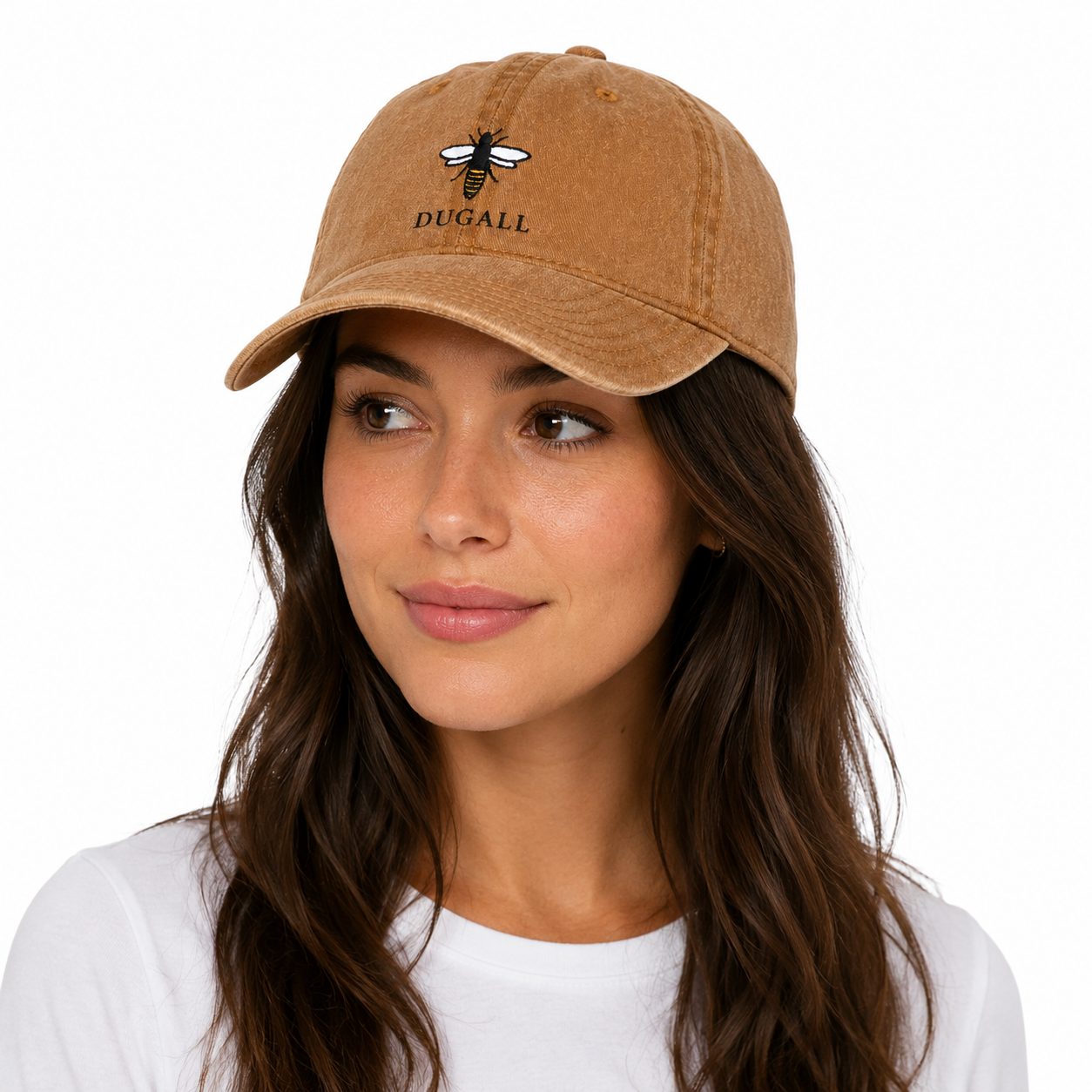 Female model wearing a honey brown washed cotton dad hat with custom bee embroidery logo.