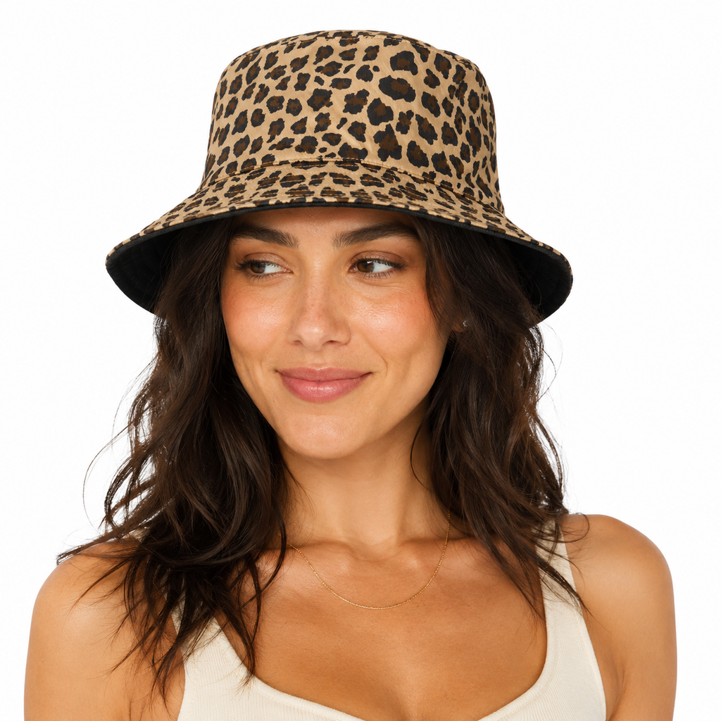 Female model wearing a reversible leopard print bucket hat with custom embroidery logo option for retail and promotional use