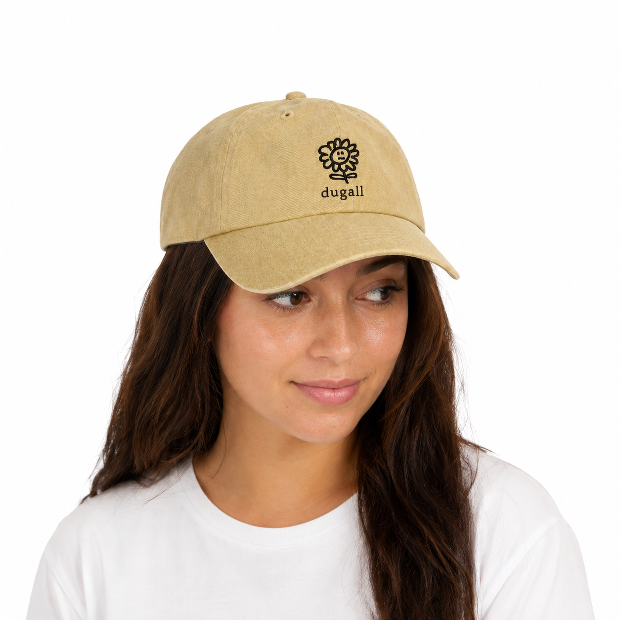 Woman wearing a beige embroidered dad hat made from 100% cotton with a relaxed unisex fit